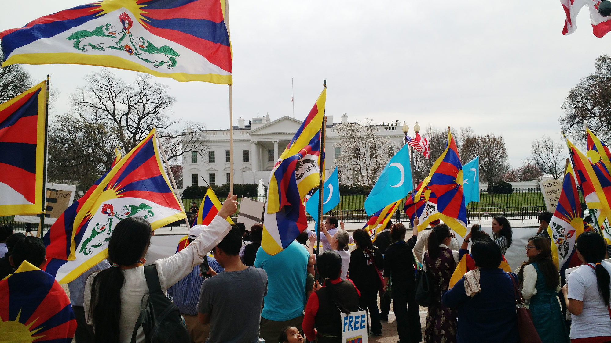 Tibetan, Uyghur, and Chinese demonstrators in front of the White House in Washington, DC.