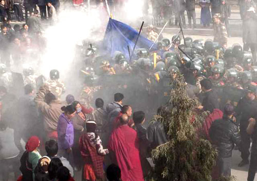 Troops are seen closing in on Dorje Rinchen's body after he has self-immolated. Troops are seen closing in on Dorje Rinchen's body after he has self-immolated.